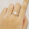 1CT Emerald Cut Moissanite Trio Stone Engagement Ring with Braided Pavé Band (1)