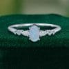 Asteria – Oval Faceted Opal Ring with Diamond Trio Accents (1)