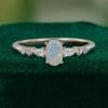 Asteria – Oval Faceted Opal Ring with Diamond Trio Accents (3)