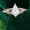 Elegant Kite Cut Moissanite Bridal Ring with Twisting Diamond Accents (1)