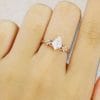 Elegant Kite Cut Moissanite Bridal Ring with Twisting Diamond Accents (2)