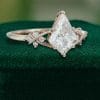 Elegant Kite Cut Moissanite Bridal Ring with Twisting Diamond Accents (4)