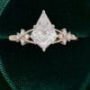 Elegant Kite Cut Moissanite Bridal Ring with Twisting Diamond Accents (5)