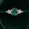 Elegant Pear Emerald Engagement Ring with Diamond Blossom Cluster Detailing (2)