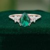 Elegant Pear Emerald Engagement Ring with Diamond Blossom Cluster Detailing (4)
