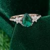 Elegant Pear Emerald Engagement Ring with Diamond Blossom Cluster Detailing.0