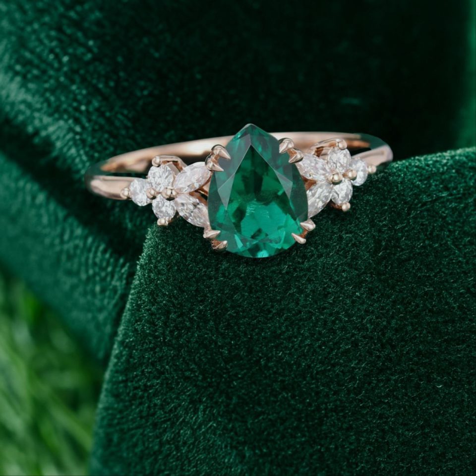 Elegant Pear Emerald Engagement Ring with Diamond Blossom Cluster Detailing.0