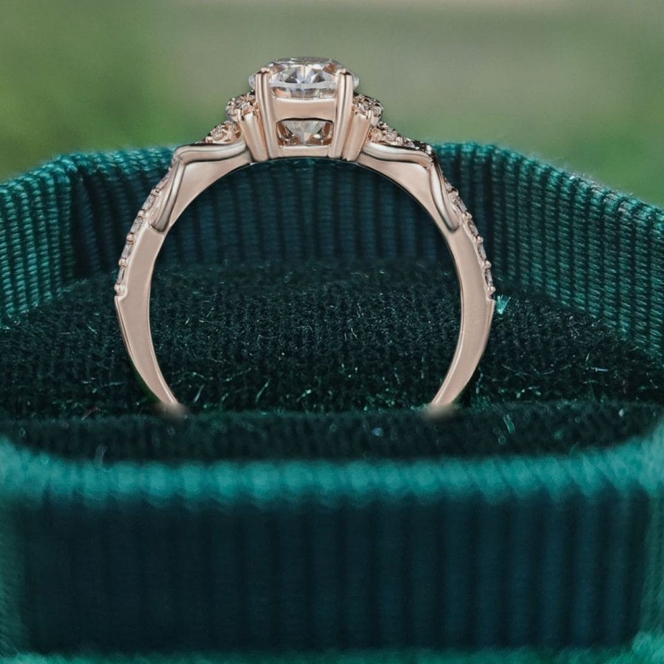 Elegant Pear Moissanite Ring with Infinity Twist Pavé Design (3)