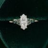 Marquise Cut Moissanite Ring with Vibrant Green Blue Sapphire Accents (7)