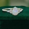 Pear Shaped Opal Engagement Ring with Dazzling Moissanite Cluster Accents (3)