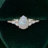 Pear Shaped Opal Engagement Ring with Dazzling Moissanite Cluster Accents (4)