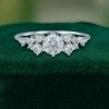 Snowdrift Round Cut Moissanite Engagement Ring with Symmetrical Cluster Design (1)