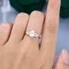 Sophisticated Oval Moissanite Engagement Ring with Double Claw Blossom Detail .0
