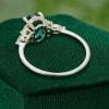 Timeless Oval Cut Emerald and Diamond Cluster Engagement Ring .0