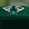 Timeless Oval Cut Emerald and Diamond Cluster Engagement Ring (2)