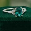 Timeless Oval Cut Emerald and Diamond Cluster Engagement Ring (3)