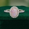 Opulent Oval Pink Opal Halo Ring with Moissanite Pavé Accents (3)