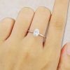 Oval Cut Moissanite Solitaire Ring in White Gold Trellis Setting (2)