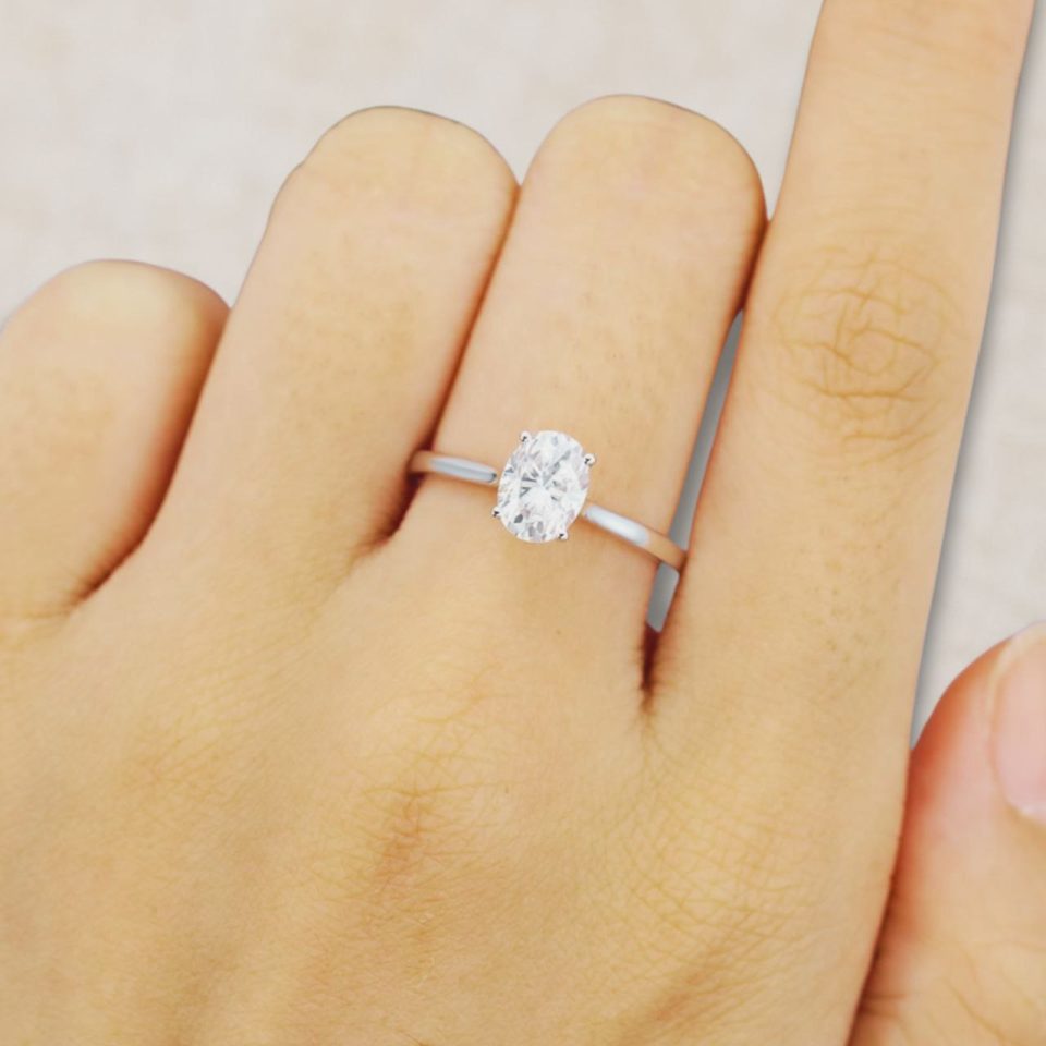 Oval Cut Moissanite Solitaire Ring in White Gold Trellis Setting (2)