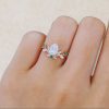14K Rose Gold Pear Shaped Moissanite Engagement Ring with Emerald Leaf Accents (1)