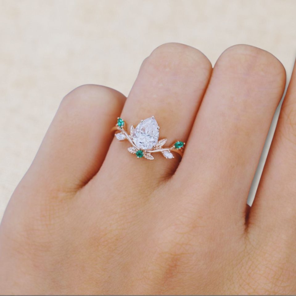 14K Rose Gold Pear Shaped Moissanite Engagement Ring with Emerald Leaf Accents (1)
