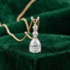 Diamond Accented Pear Cut Moissanite Three Stone Pendant Necklace6