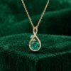 Infinity Pendant Necklace with Round Cut Emerald and Leaf Accents2