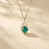 Infinity Pendant Necklace with Round Cut Emerald and Leaf Accents6