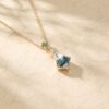 Kite-Cut Moss Agate Pendant with Emerald Floral Accent1