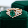 Rose Gold 6×8 mm Oval-Cut Lab Emerald Bridal Ring Set (1)